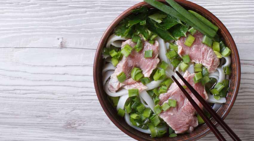 Vietnamese Pho Bo soup with beef and rice noodles