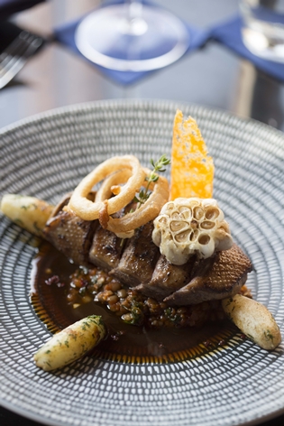 PAPRIKA RUB ROAST DUCK BREAST Spinach & puy lentil, grand marnier thyme jus, crisp onion rings